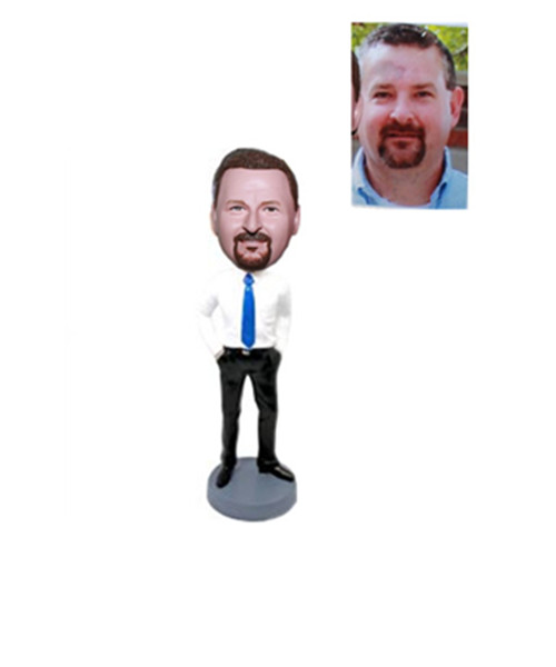 Man In White Shirt With Blue Tie Bobblehead Hands In Pockets