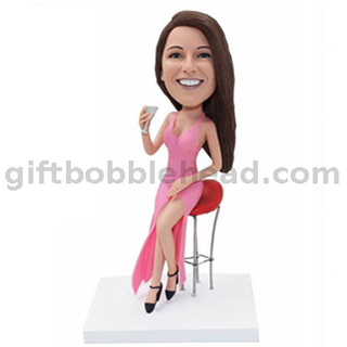 Custom Female Bobblehead Lady in Pink Dress Sitting on Bar Stool with Cocktail in Hand